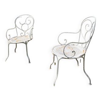 Duo of wrought iron armchairs