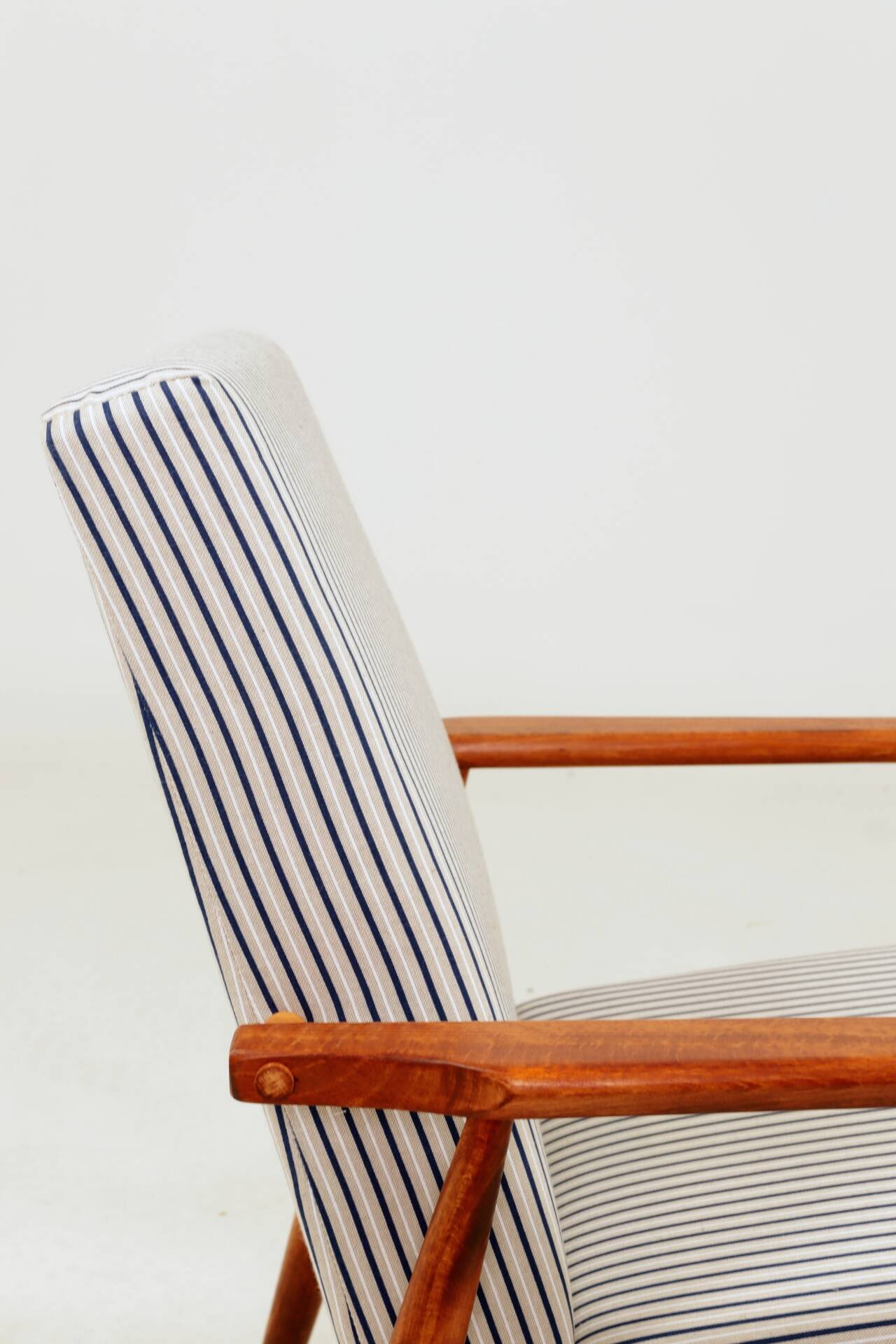 Armchair with striped fabric footrest, 1960
