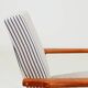 Armchair with striped fabric footrest, 1960