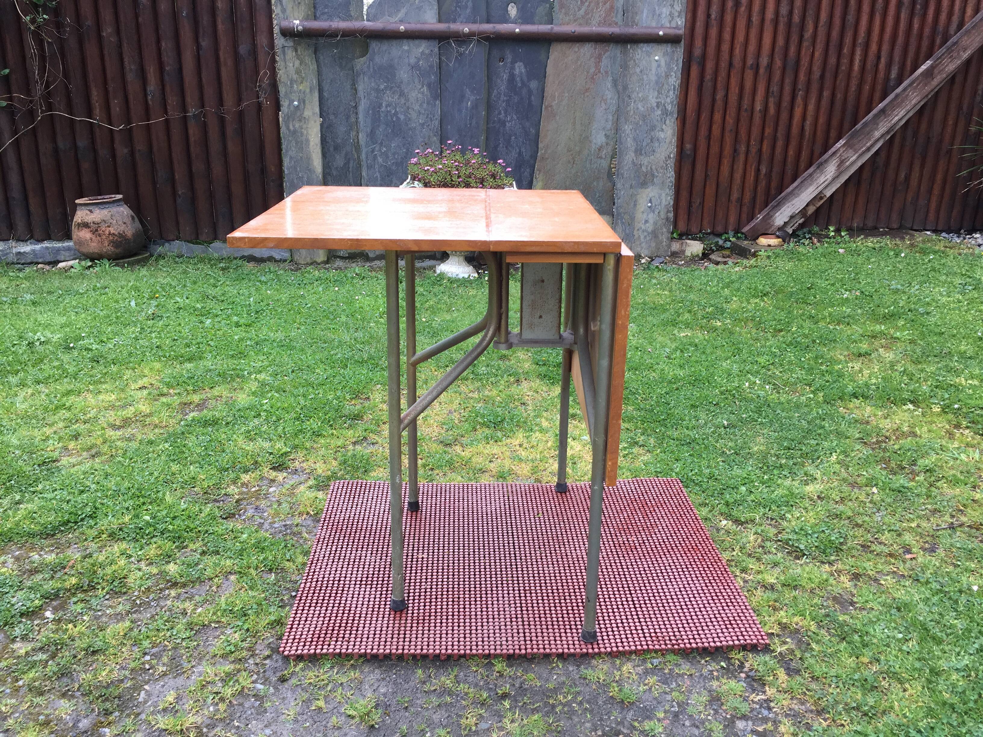 Vintage folding table with teak flaps said wallet with metal tubular base