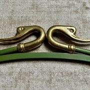 Rare set of swan neck coat hooks with mirror frame attributed to Maison Jansen, France, 1950s.