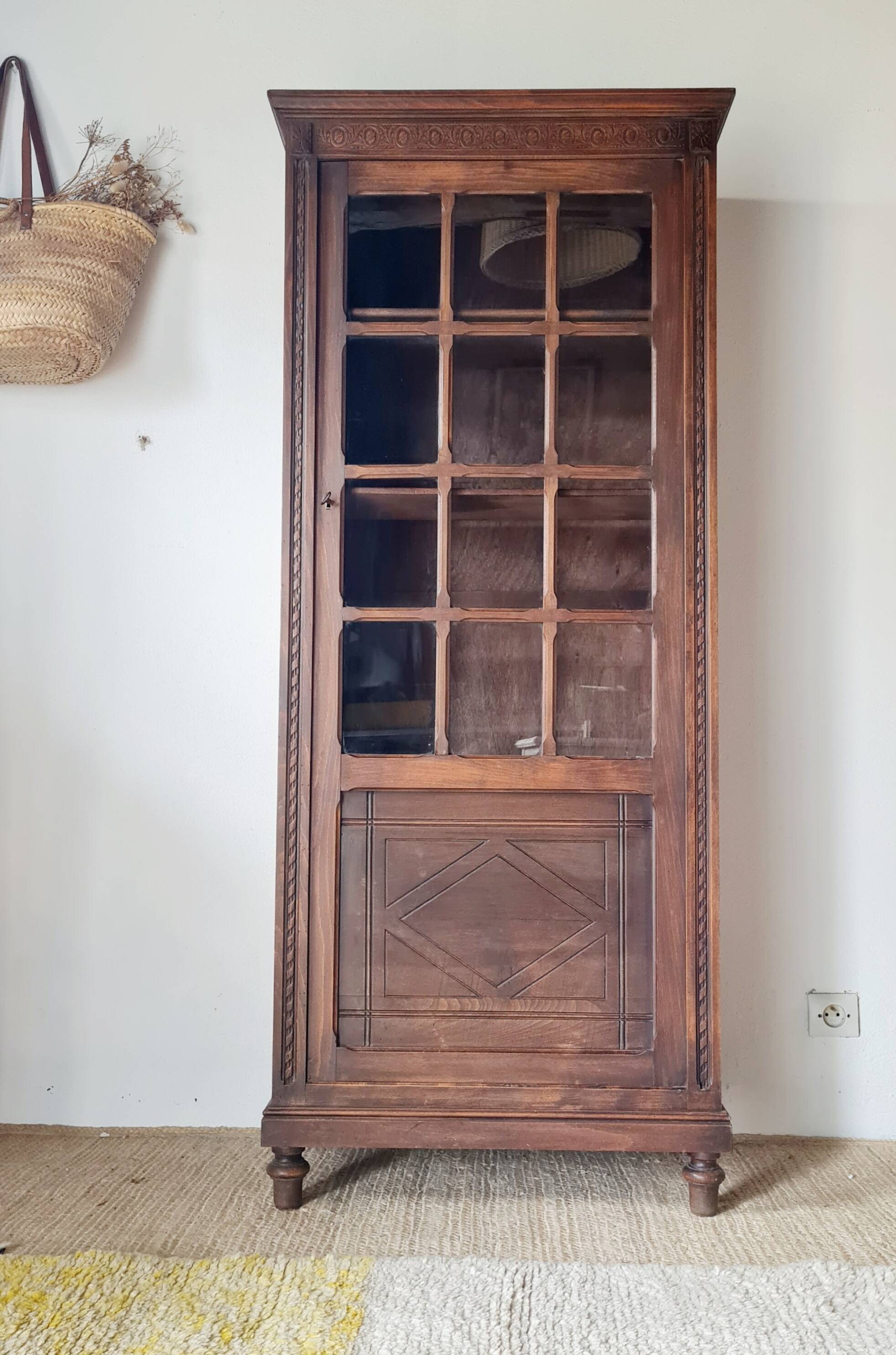 Old glass-fronted library in solid wood