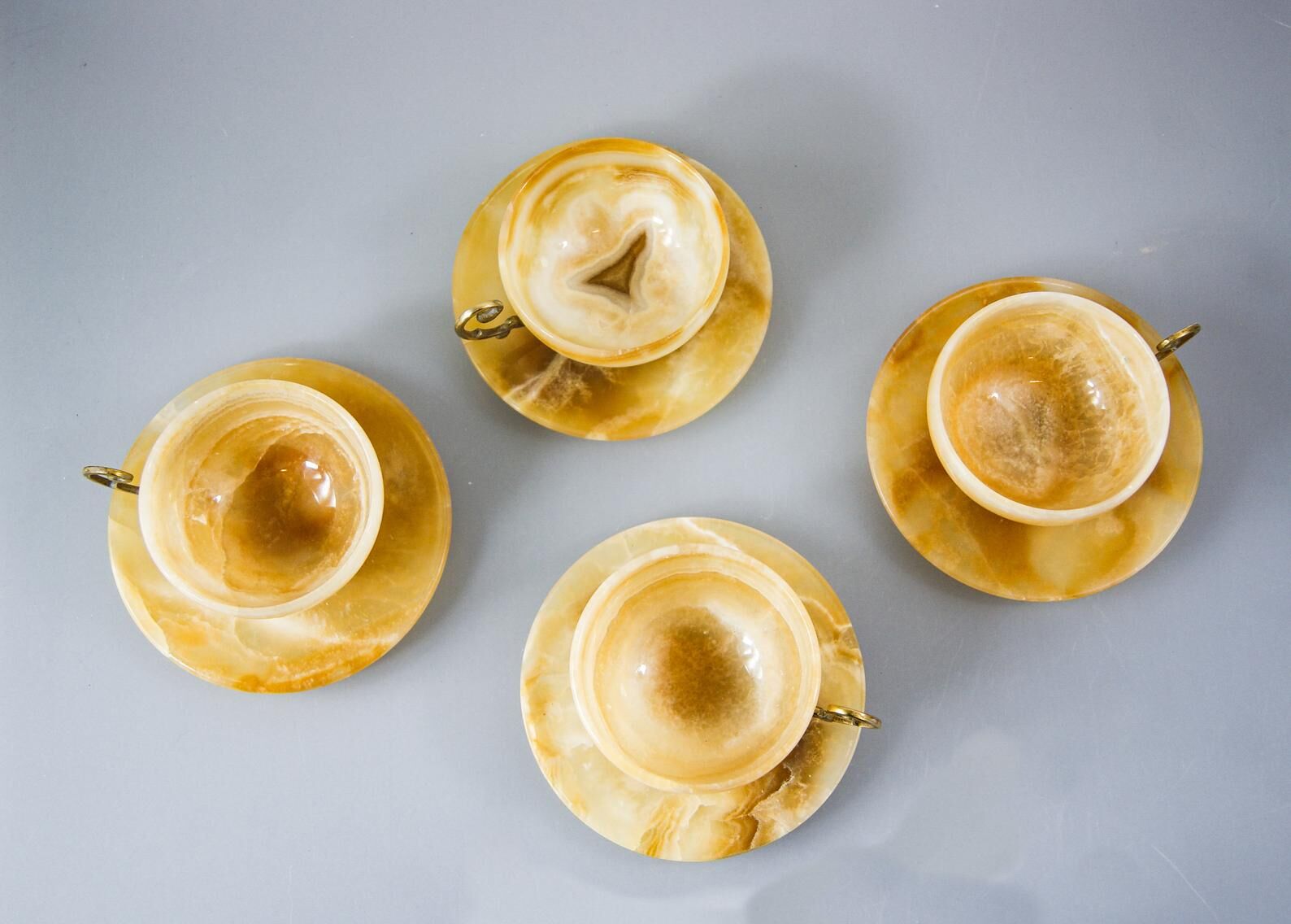 Set of 4 marble and brass espresso cups and saucers