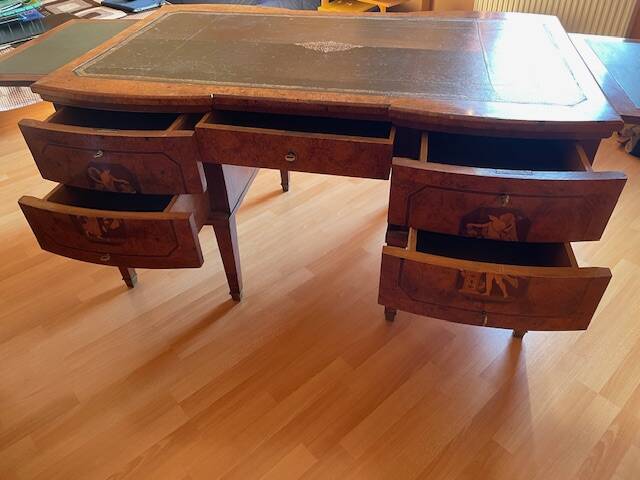 Antique Empire-style desk in burr veneer, green leather, with a dash.