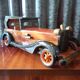 Toy car made of varnished wood