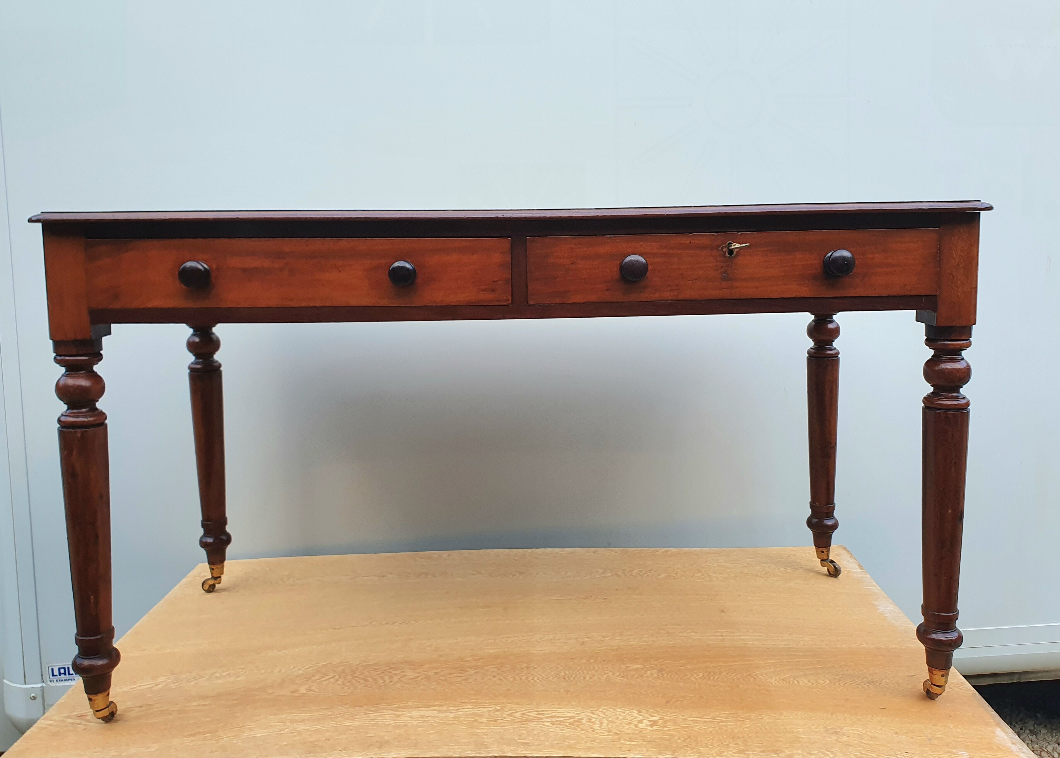 English desk with 2 drawers on green leather