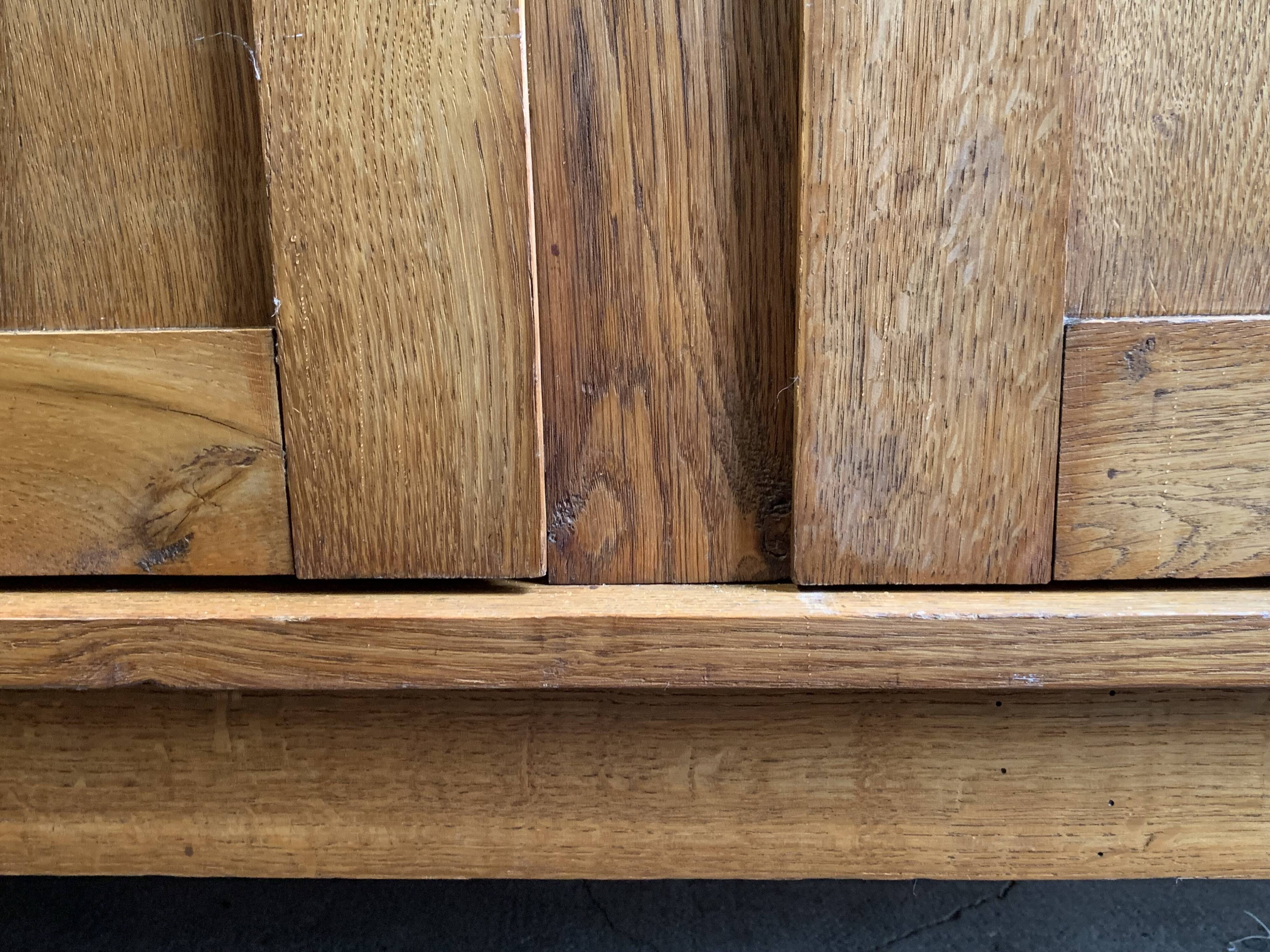 Solid oak compass foot cabinet René Gabriel 1945