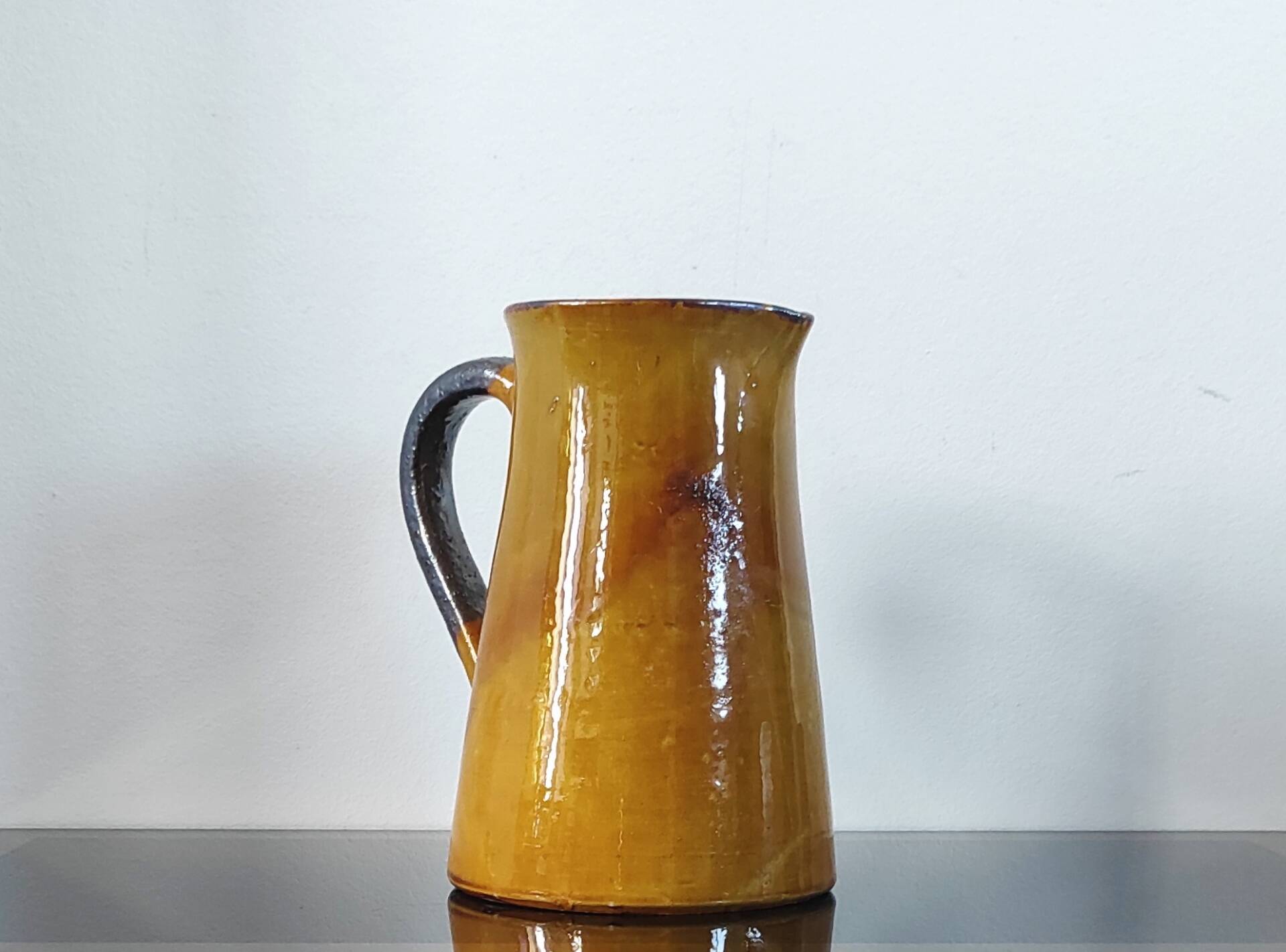 Vintage glazed terracotta pitcher