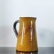 Vintage glazed terracotta pitcher