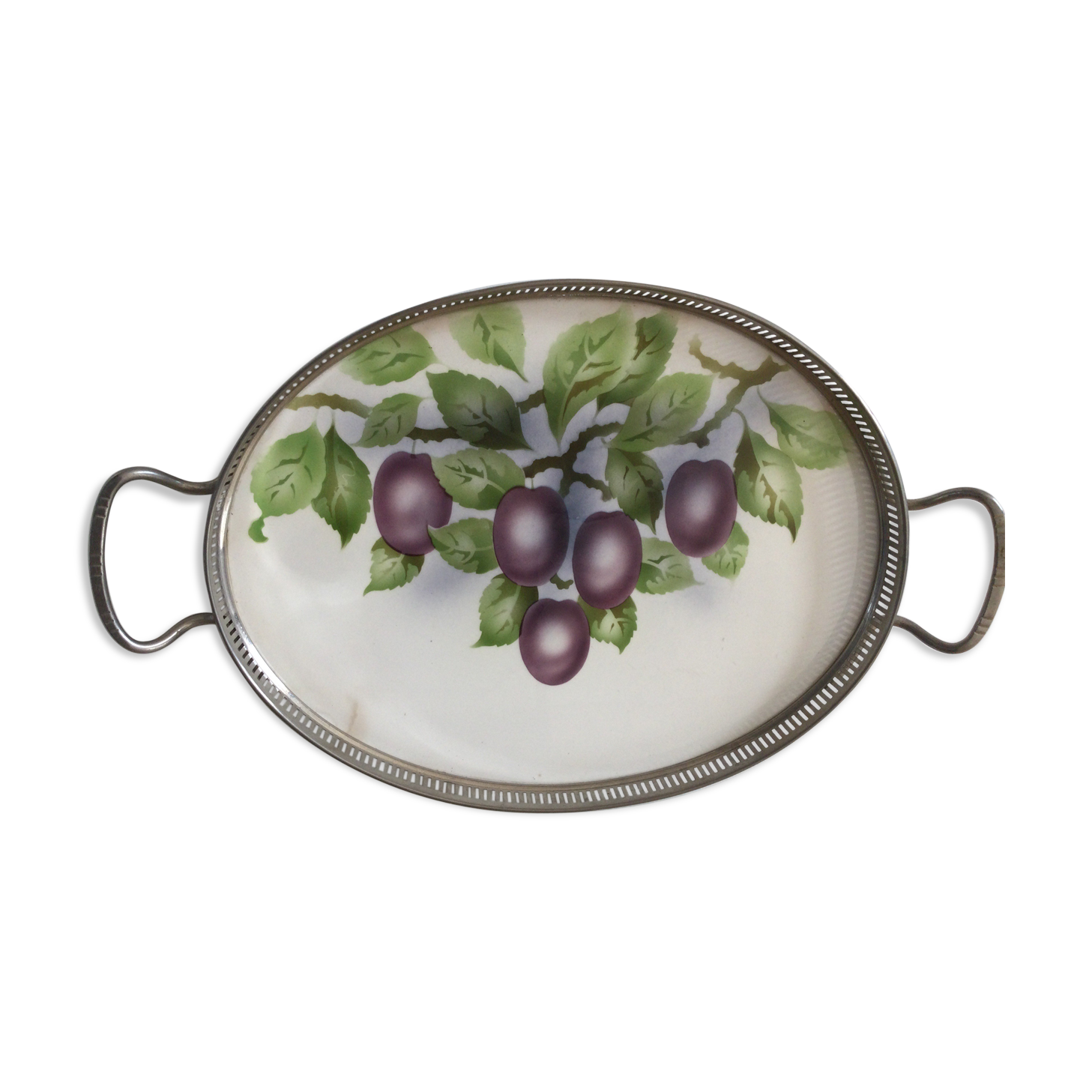 Vintage earthenware tray surrounded by antique metal