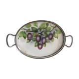 Vintage earthenware tray surrounded by antique metal