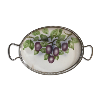 Vintage earthenware tray surrounded by antique metal
