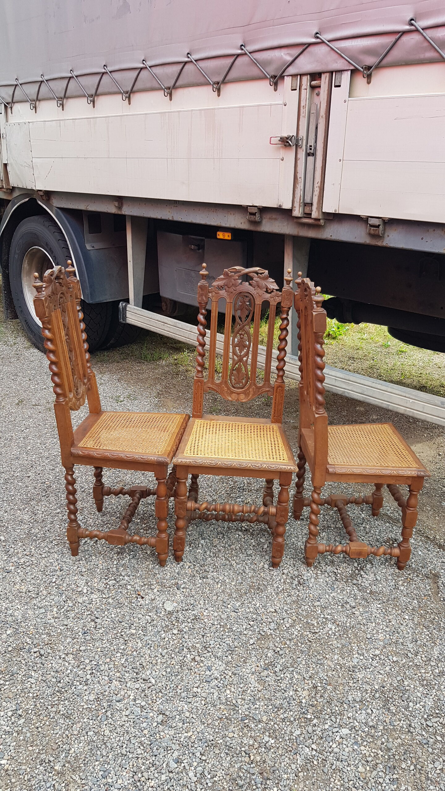 Carved antique chairs with rattan seat