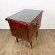 1950s bedside table in varnished wood veneer and brass.