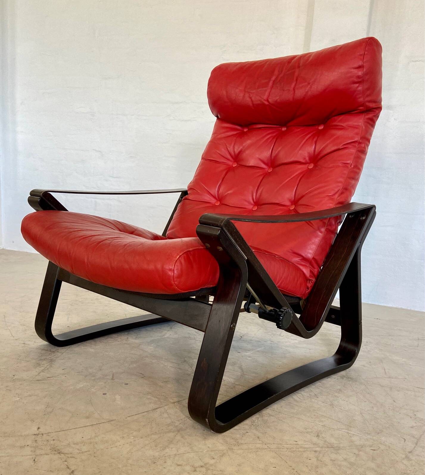 Vintage danish retro reclining lounge chair & stool in red leather by komfo