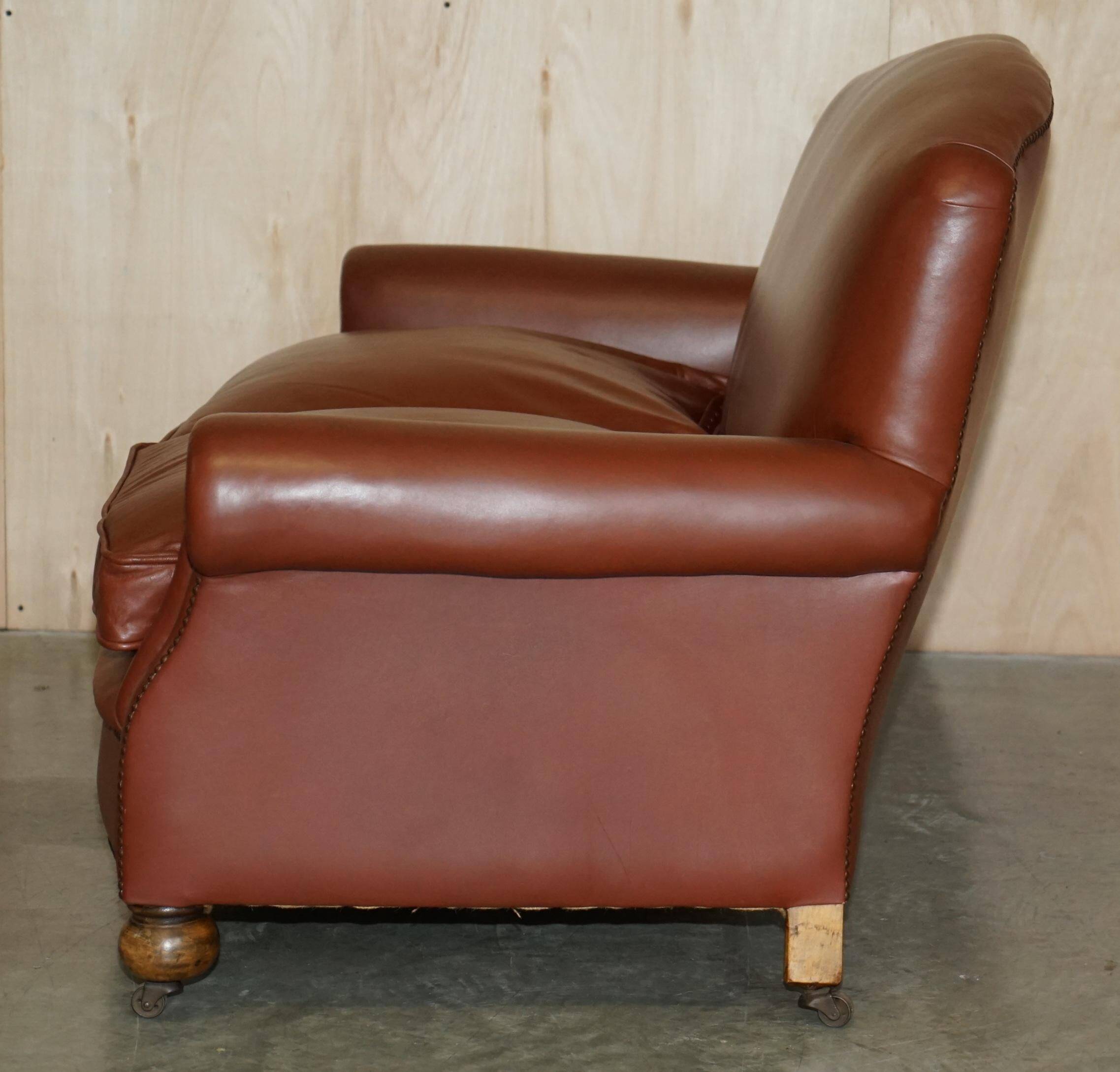Edwardian leather club canapé circa 1910 with feather cushions.