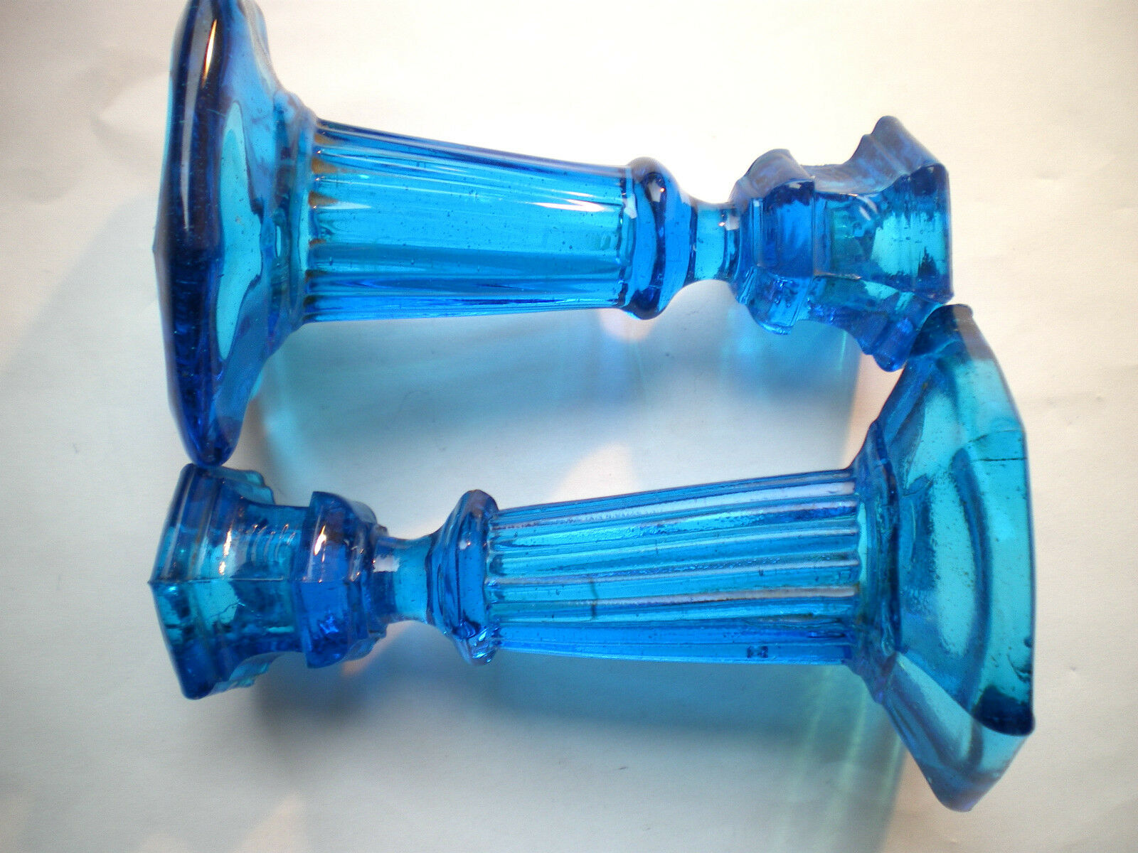 2 blue glass doll candlesticks