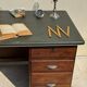 Modernist desk in wood and green moleskin upholstery