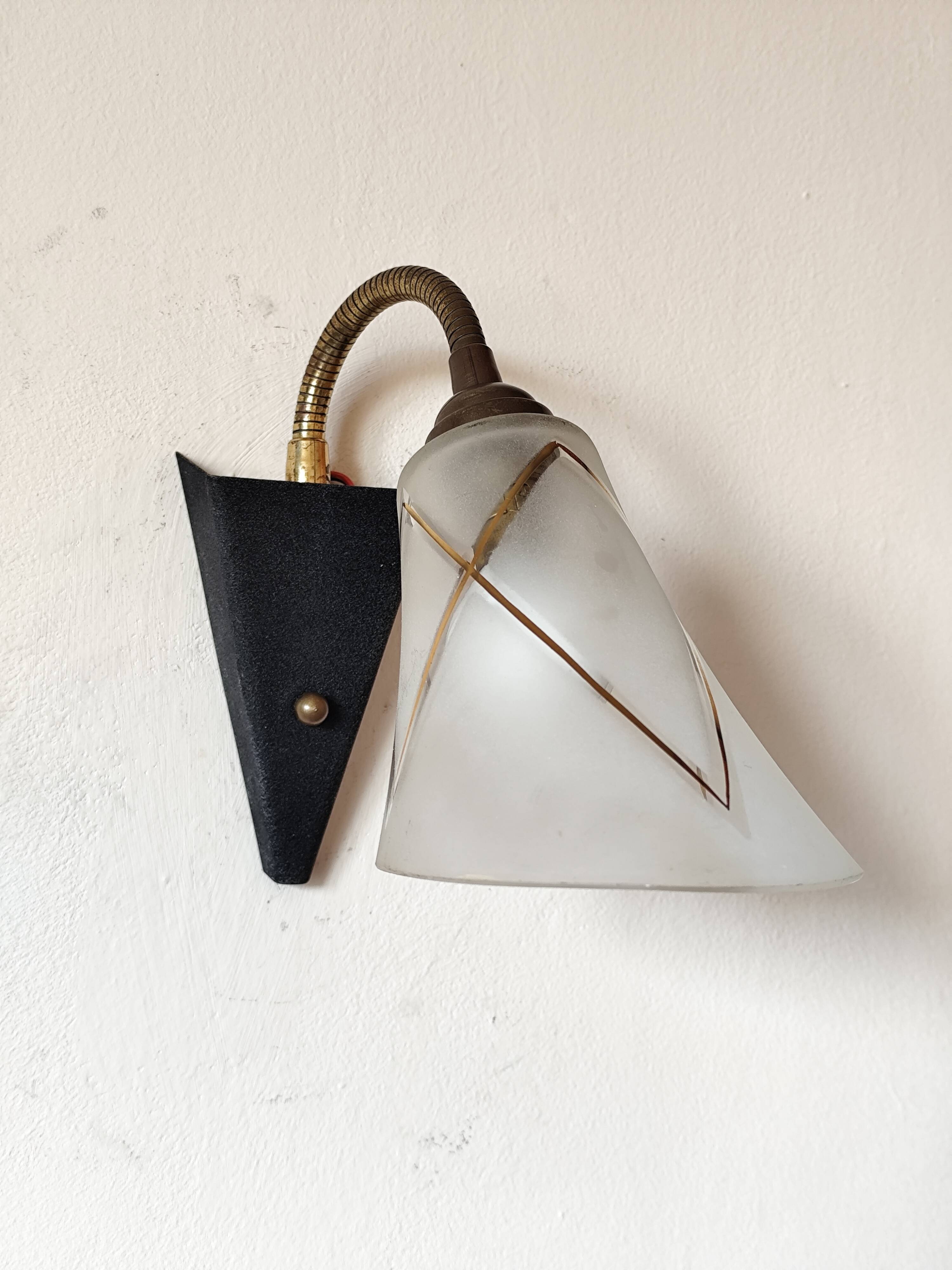 1950s wall lamp, metal, flexible brass stem and opaque shade.