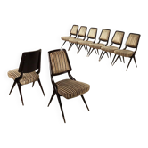 Set of eight vintage chairs with brass tips.