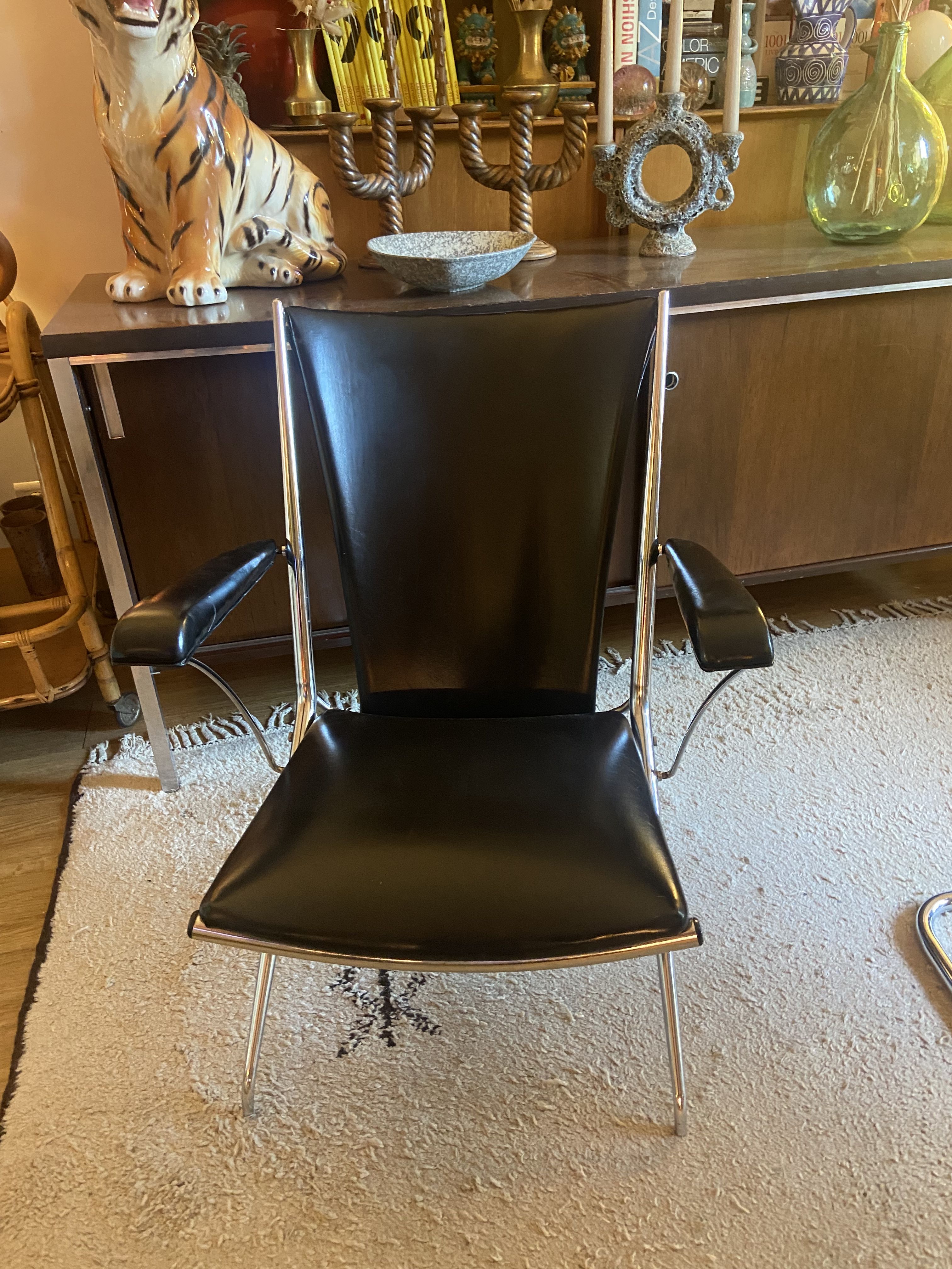 Metal armchair and black skaï