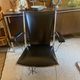 Metal armchair and black skaï
