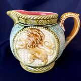 Small onnaing barbotine jug with lion decoration
