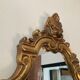 Old italian mirror in gilded plaster with leaf
