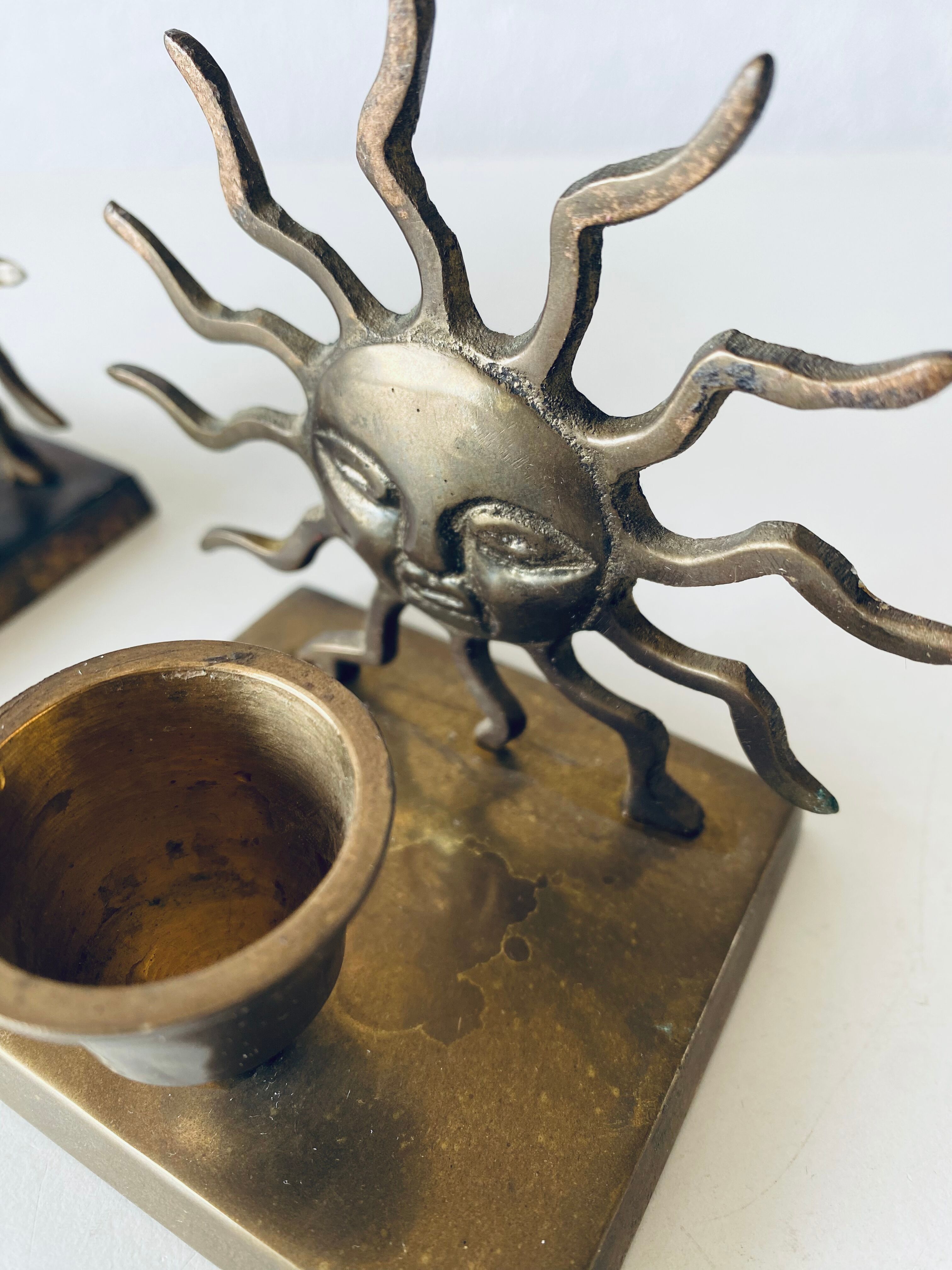 Pair of sun candle holders
