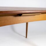 Dining table in teak with extentions and legs in oak, of danish design from the 1960s.