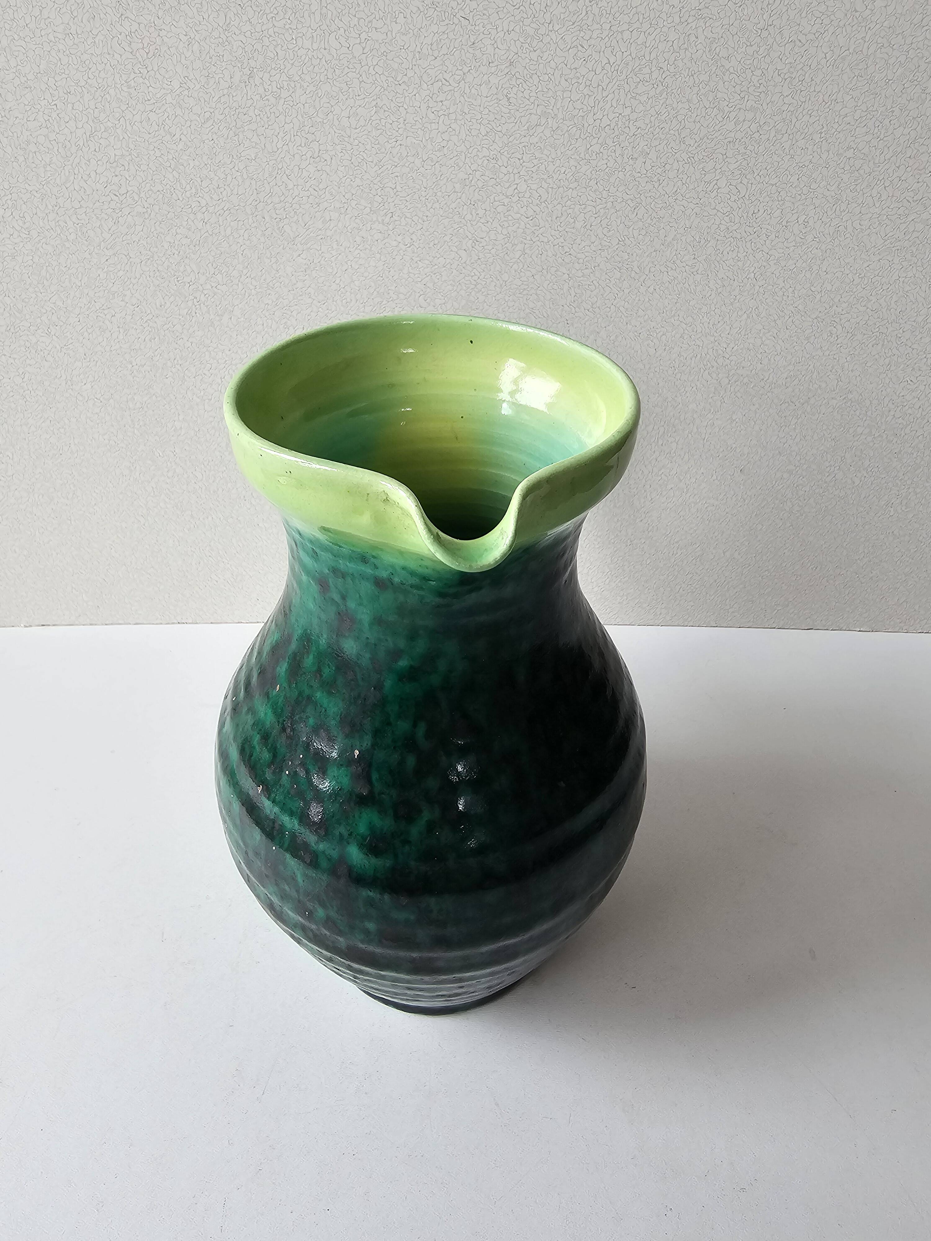 Green glazed ceramic pitcher Signed ACCOLAY
