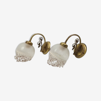 Pair of brass sconces with glass lampshades and beads