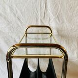 Magazine rack, saddle on vintage wheels