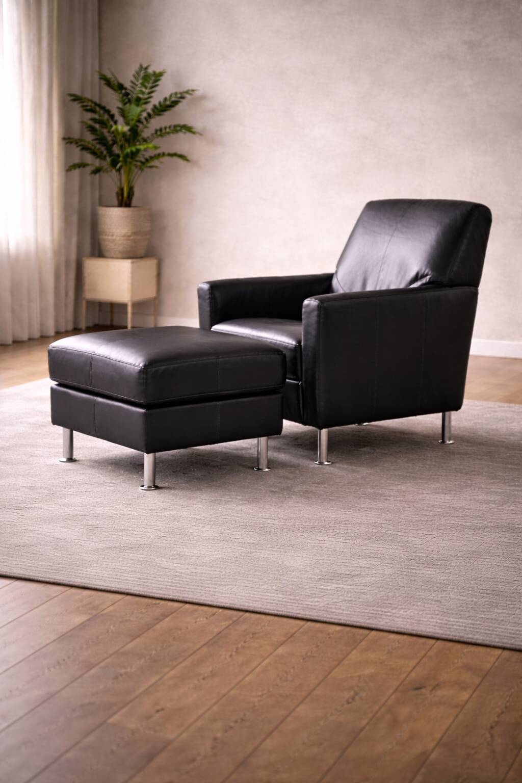 Modern Lounge Armchair with Matching Footstool — Black Leather