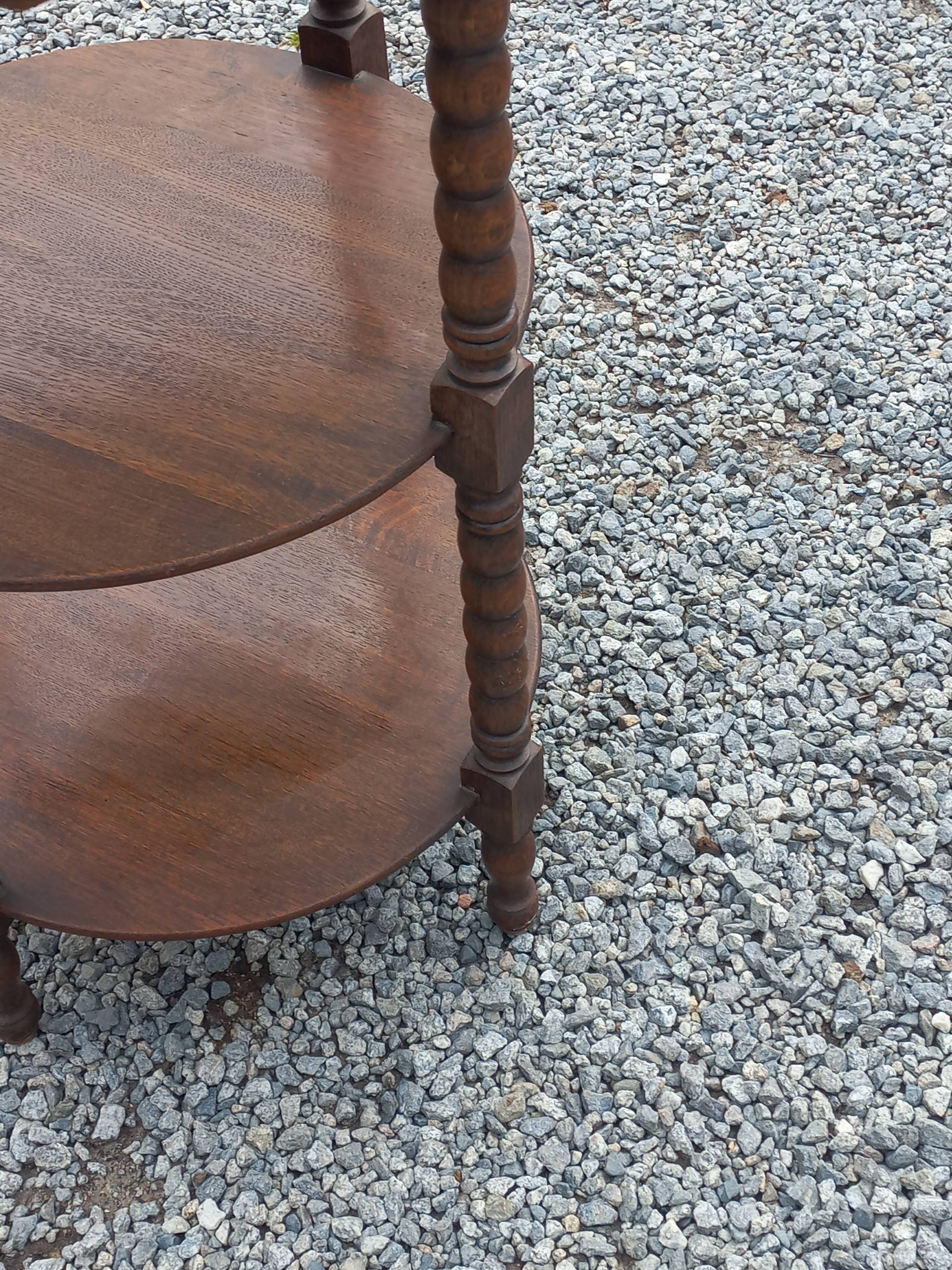 Vintage oak pedestal table with 3 shelves from the 60s