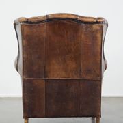 Sheep leather wing chair with patina