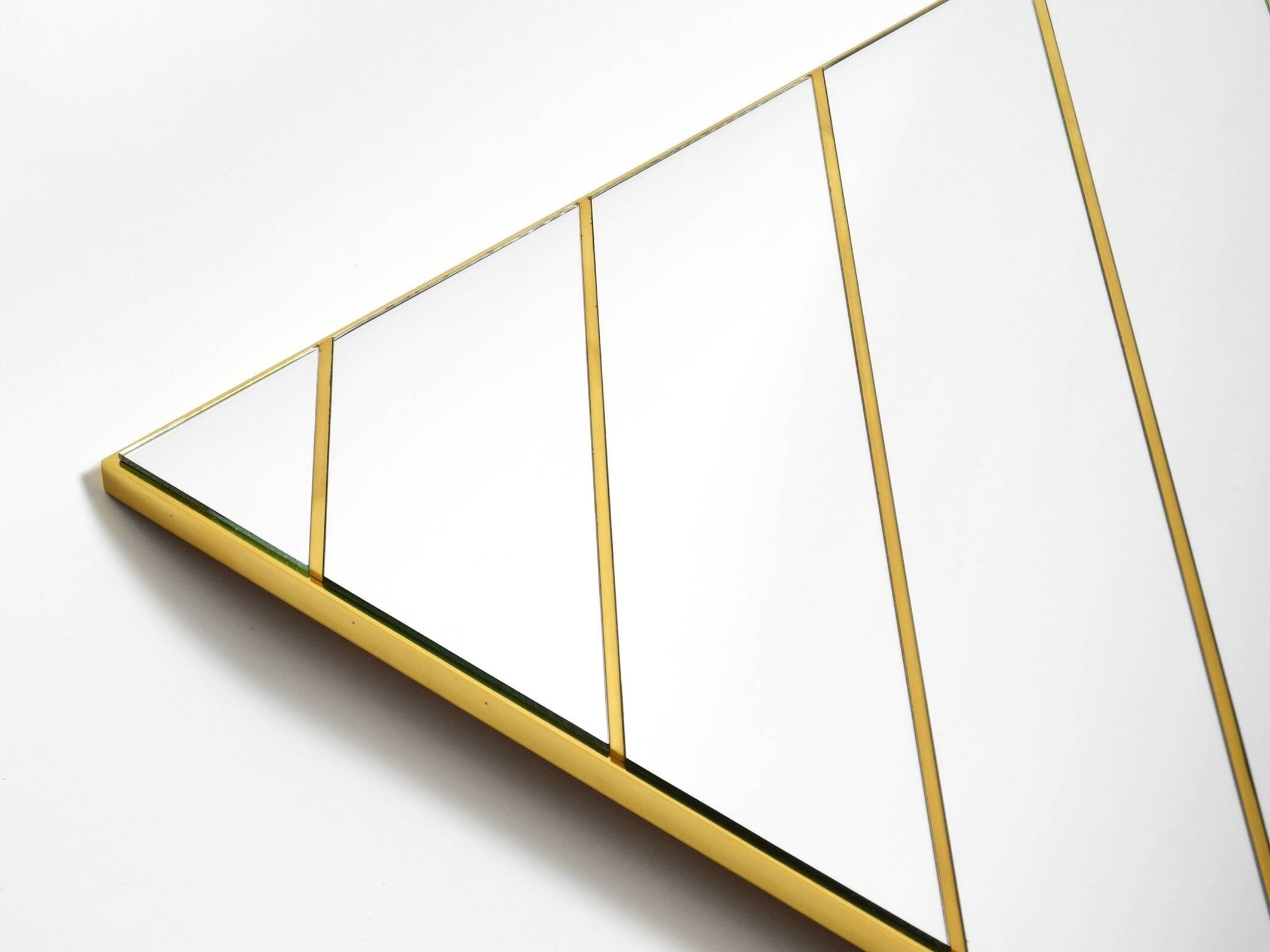 Large, exceptional 1970s brass wall mirror with diagonal mirror strips