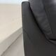 Two-seater black leather sofa — postmodern design