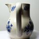 Fine earthenware pitcher with blue decoration, attributed to Saint-Uze, 19th century.
