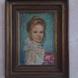 Tableau from the 20th century signed, depicting a woman with a bouquet.