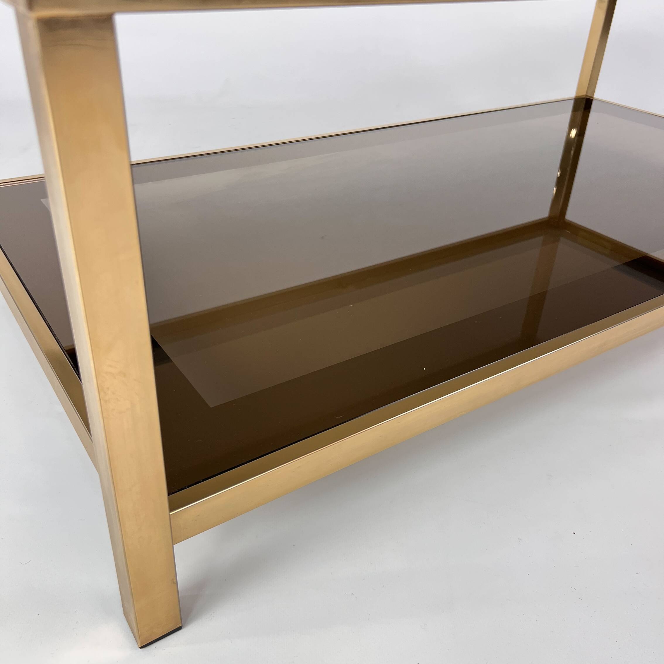 Belgo Chrome coffee table in brass and smoked mirror glass, 1970s.