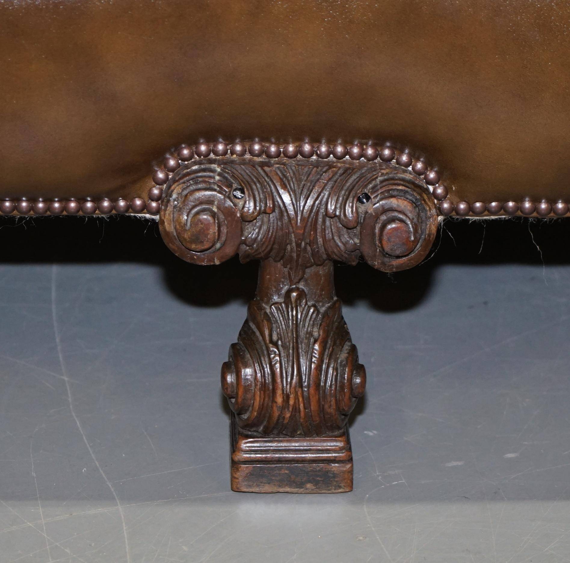 Restored Regency canapé in leather with sculpted Hermès frame.
