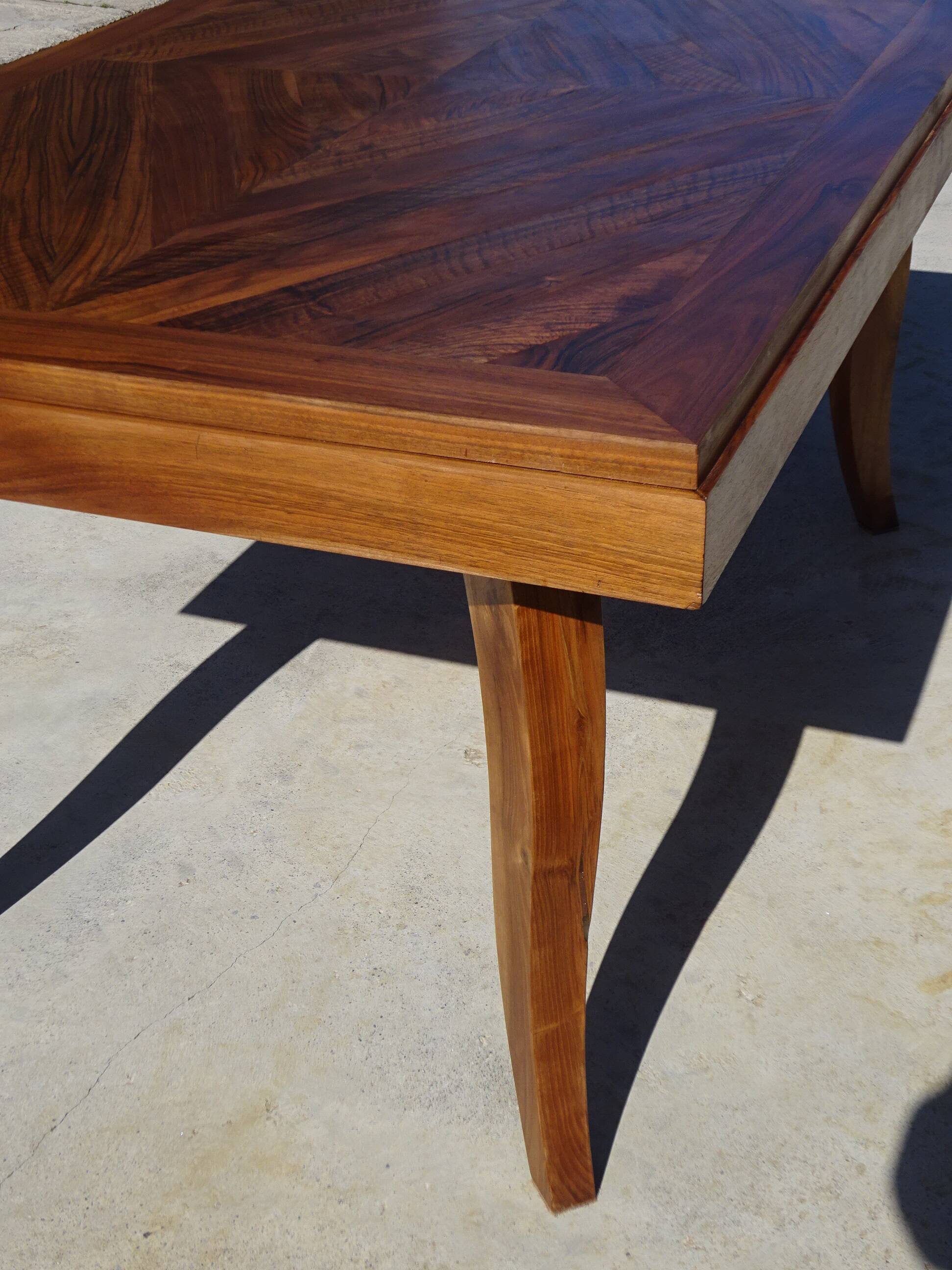 Antique solid walnut table with marquetry and extensions.