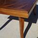Antique solid walnut table with marquetry and extensions.