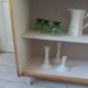 Vintage bookshelf in oak veneer, pearl grey interior, metal legs.