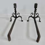 Pair of ironwork andirons in the style of Raymond Subes, circa 1940