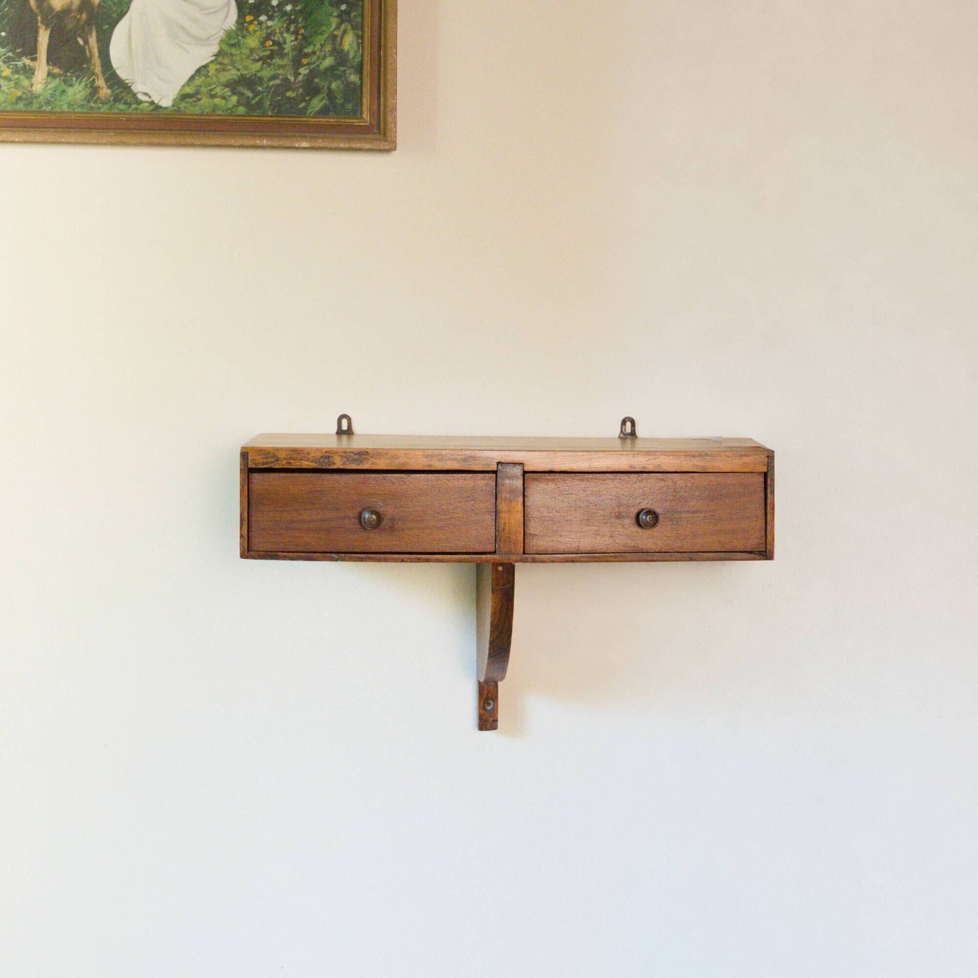 Small vintage wall console in patinated wood with two drawers.
