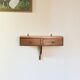 Small vintage wall console in patinated wood with two drawers.