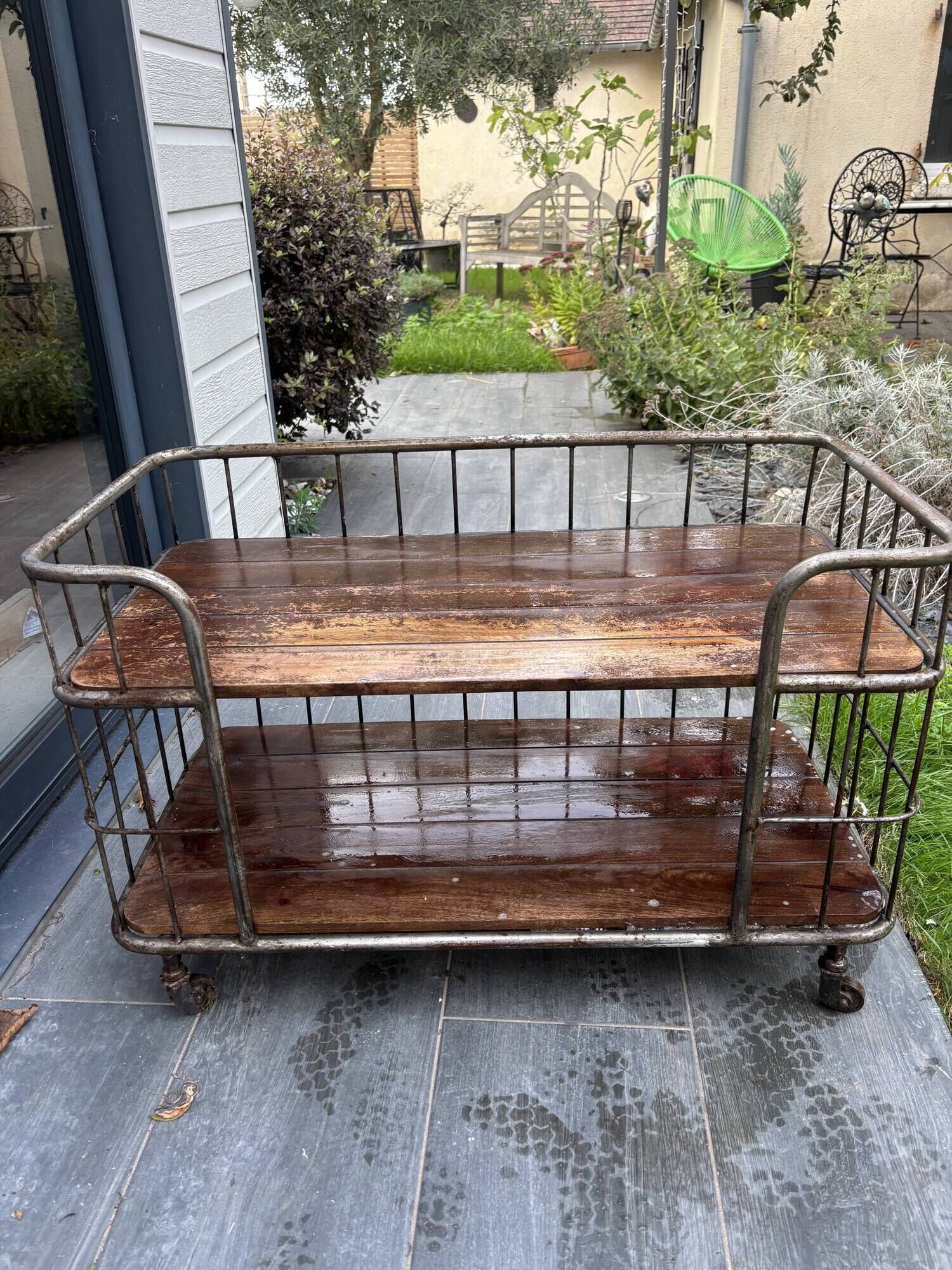 Industrial metal and wood serving trolley on wheels