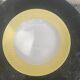 Two earthenware dishes, one hollow and one white cake dish with yellow border